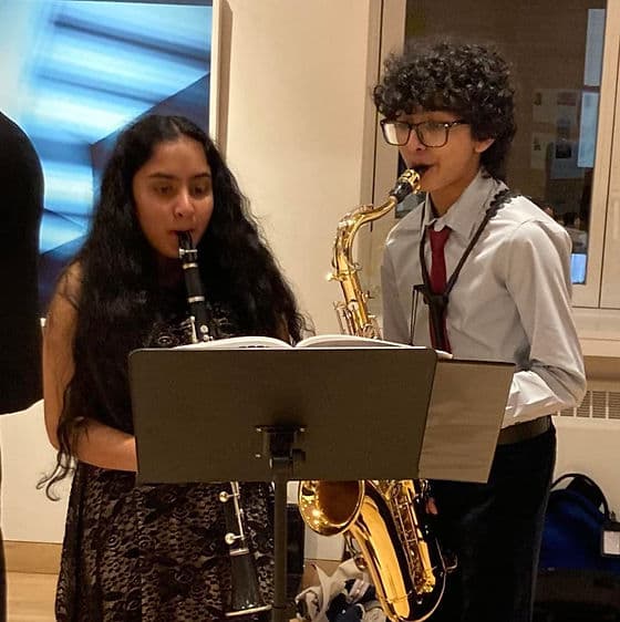 Young musicians playing clarinet and saxophone